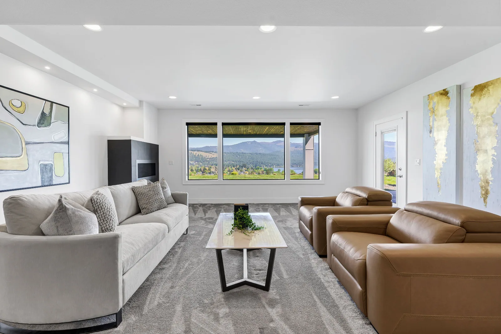 Lower-level family room with lake and mountain view windows