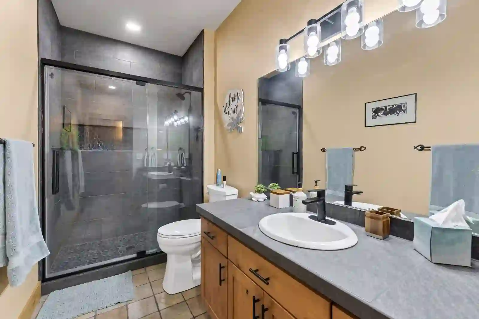 Guest bath with walk-in tile shower and pebble floor