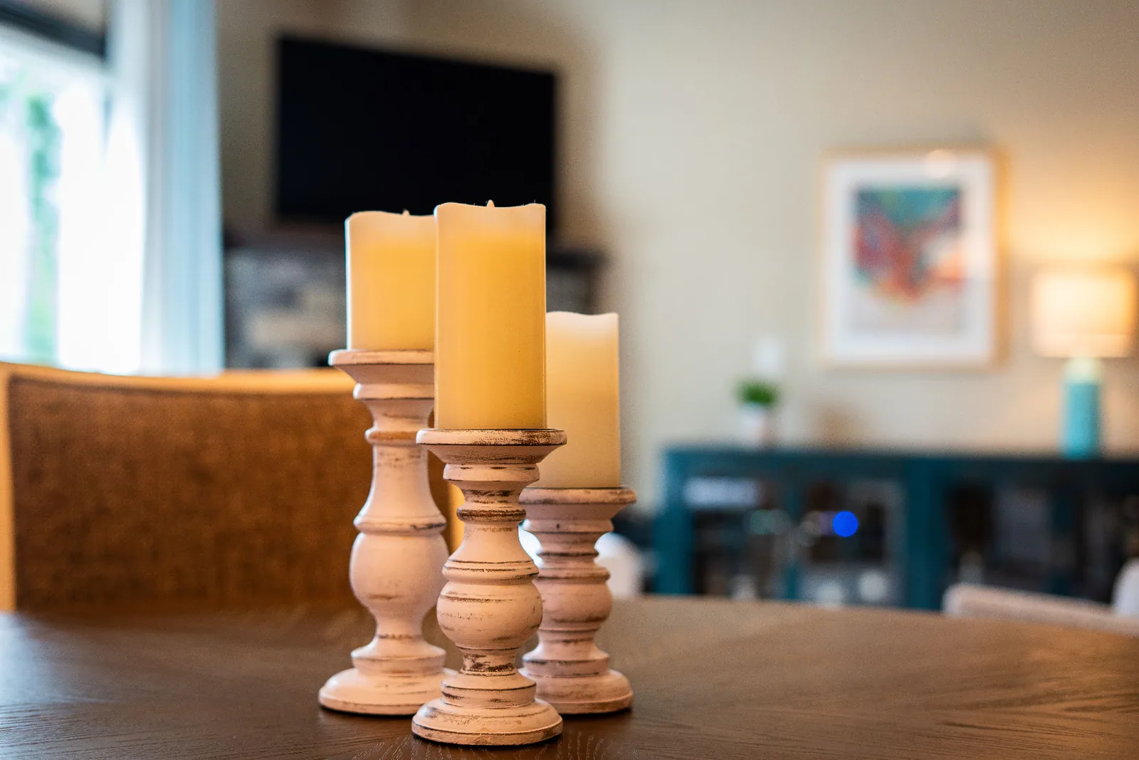 Candle detail on the dining table with the living room beyond