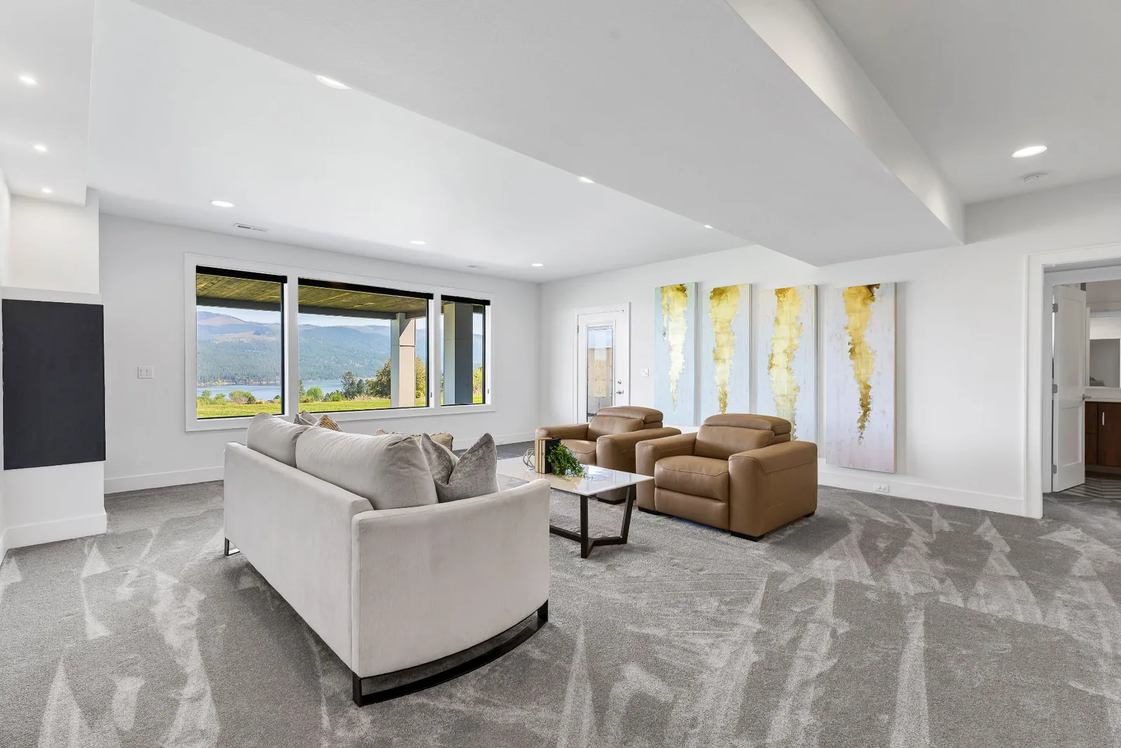 Second seating area on the lower level with wall of artwork