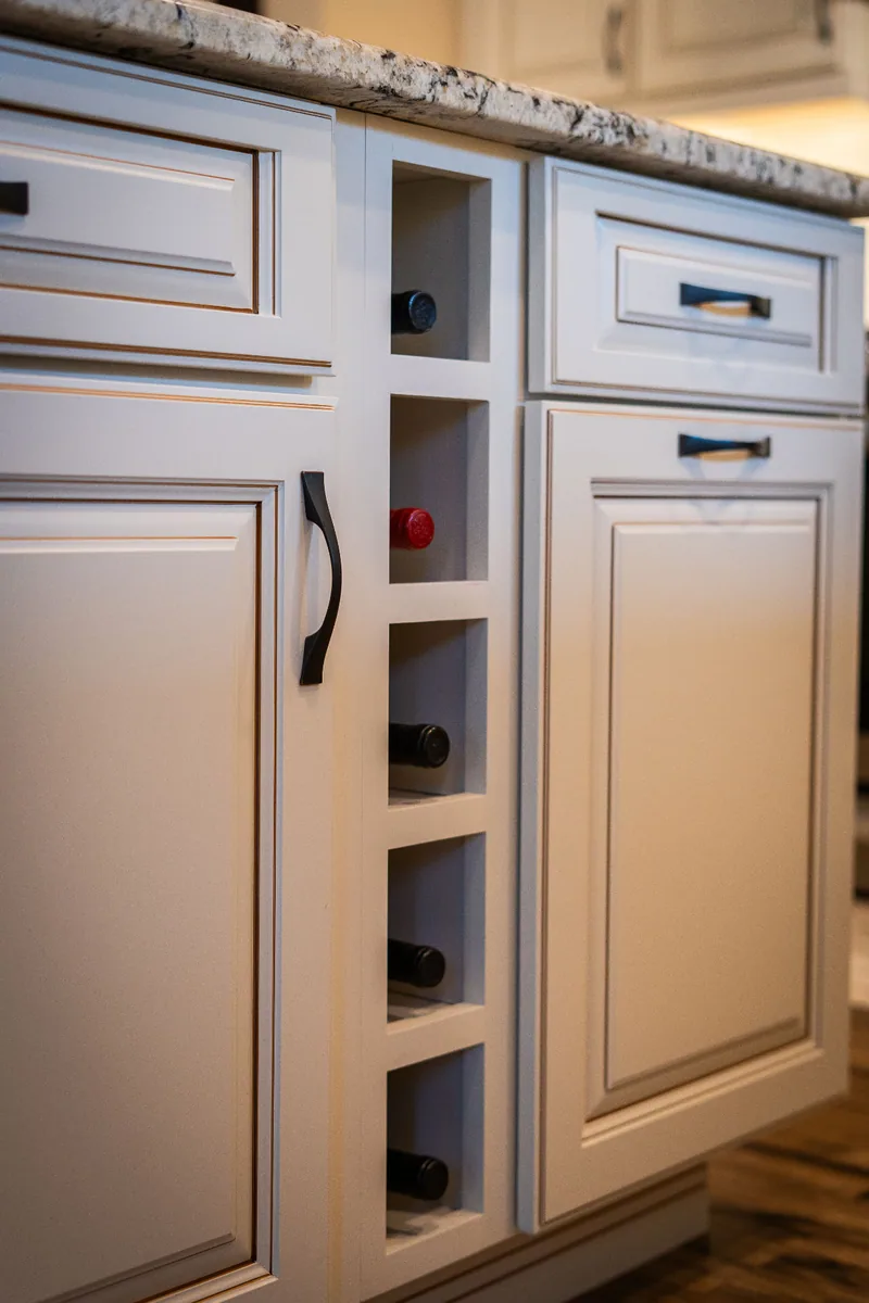 Built-in wine storage detail in the kitchen island cabinetry